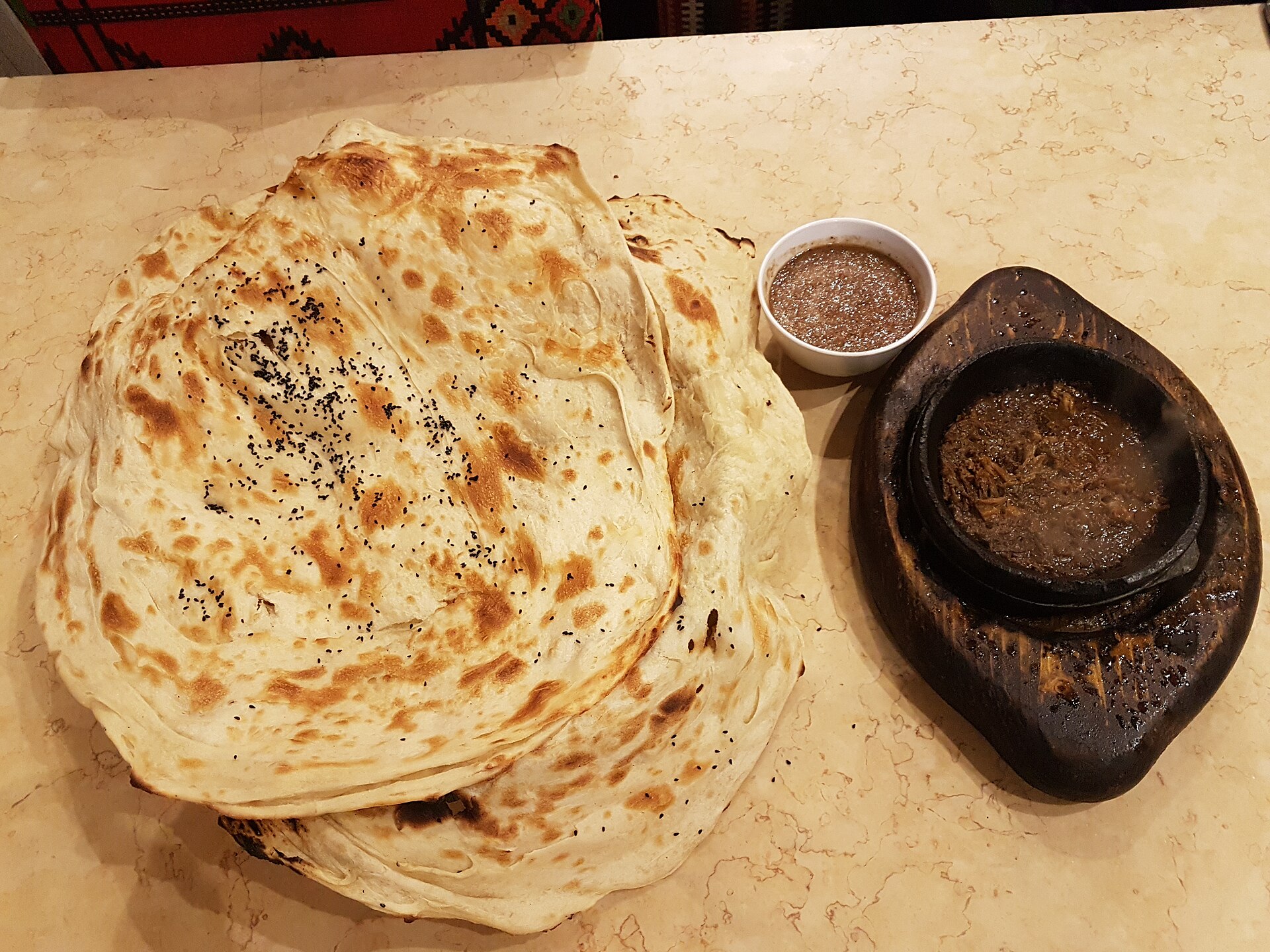 Photo de la recette « Khubz muluwah (pain plat feuilleté du Yémen) »